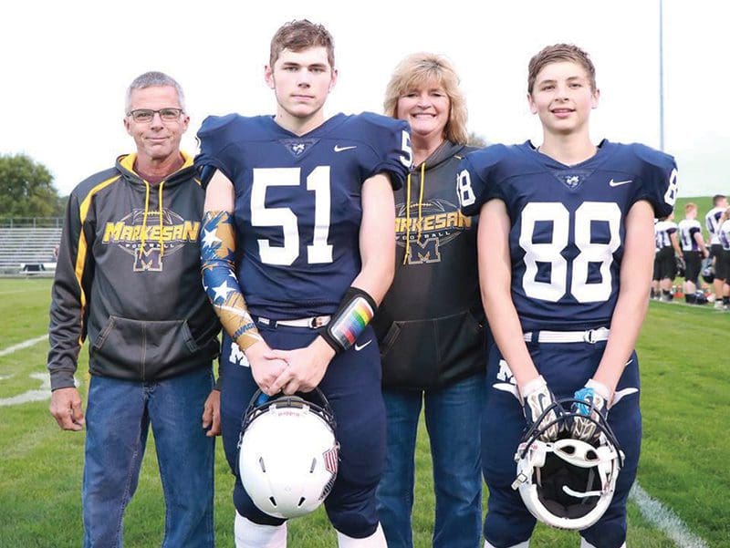 Tanner and family at parents night football game.